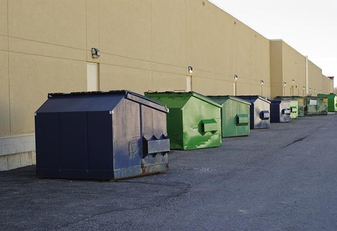 dumpsters with safety cones in a construction area in Batson